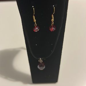 Handmade earrings and necklaces with garnet pendant.